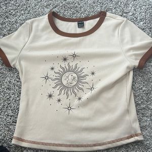 I am selling a sun and moon tan and brown t shirt